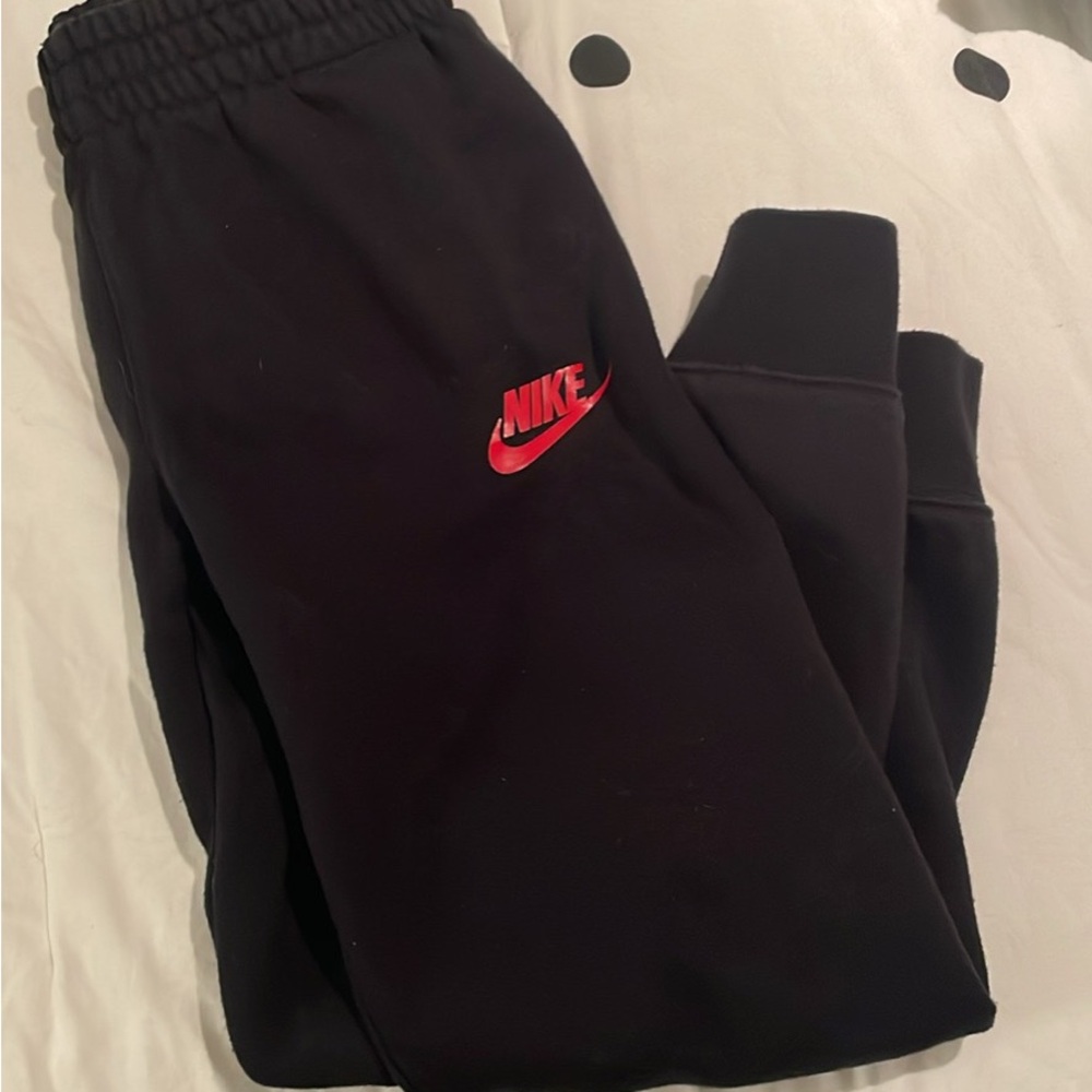 Nike Kids Black Joggers with Red Logo